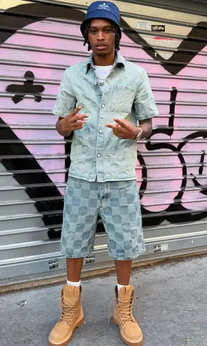 Nemzzz’s Outfit in Louis Vuitton Shirt, Prada Hat & Nike Socks (2025)