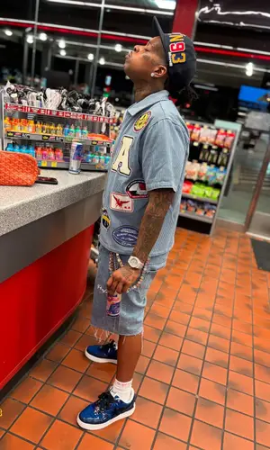 Finesse2tymes’ Outfit in Bape Sneakers, Supreme Socks & Hanes (2025)