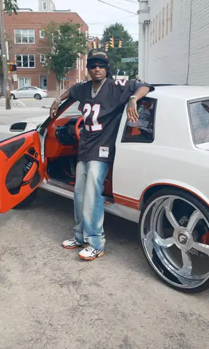 Quavo wearing Mitchell & Ness jersey