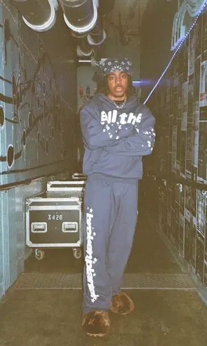 Eem Triplin wearing Broken Planet pants