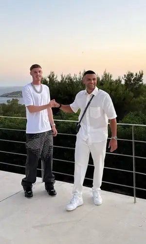 Cole Palmer wearing Louis Vuitton t-shirt