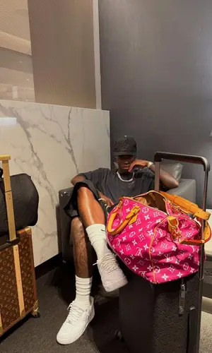 Vinicius Jr’s Outfit in Louis Vuitton Bag, Chrome Hearts Cap & Nike Socks (2025)