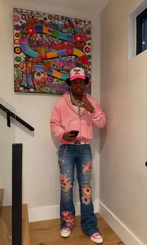 Lil Baby’s Outfit in Converse Sneakers, Chrome Hearts Belt & Wooooo! Energy Drink Merch Cap (2025)