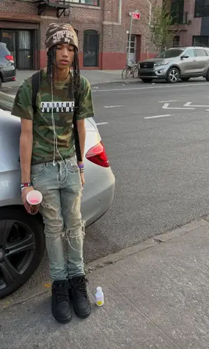 yuke wearing Supreme hat
