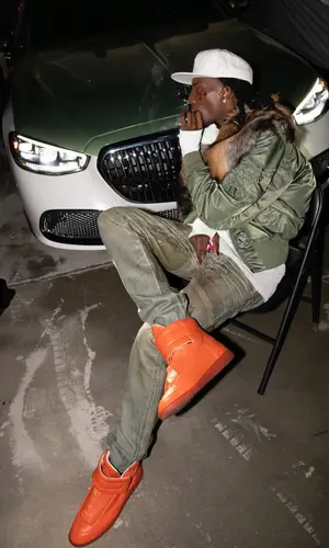 Playboi Carti’s Outfit in Dior Jeans, Maison Margiela Sneakers & Playboi Carti Merch Cap (2026)