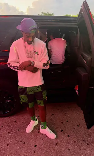 Lil Tjay’s Outfit in Matty Boy Top, Eric Emanuel Shorts & Chrome Hearts Cap (2026)
