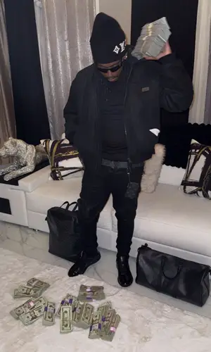 YN Jay wearing Goyard backpack