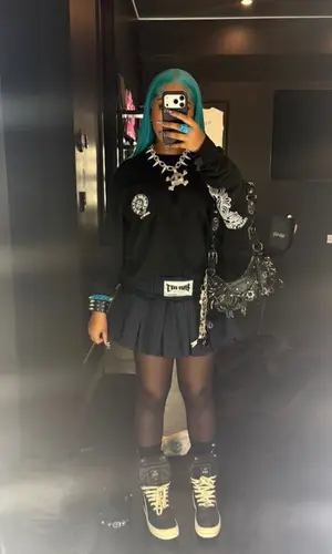 North West wearing Balenciaga bag