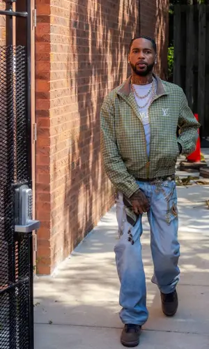 Key Glock’s Outfit in Louis Vuitton Jacket, Acne Studios Jeans & Rolex Watch (2026)