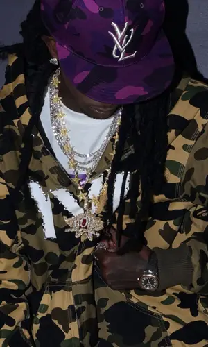 Playboi Carti’s Outfit in Patek Philippe Watch, Bape Cap & Playboi Carti Merch (2026)
