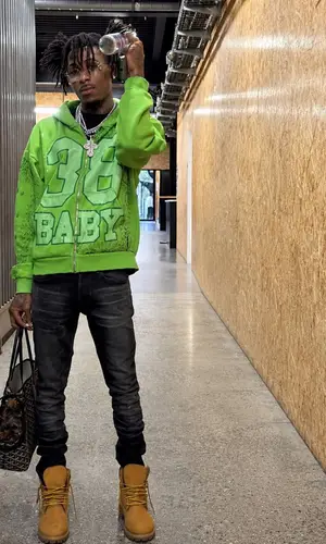 NBA YoungBoy wearing Timberland boots