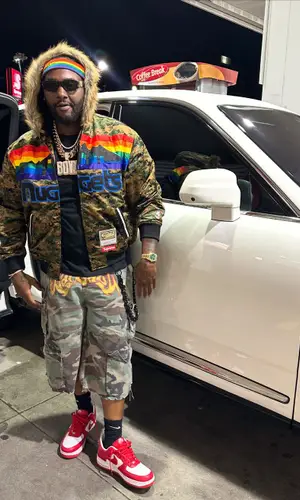 Peezy wearing Rolex watch