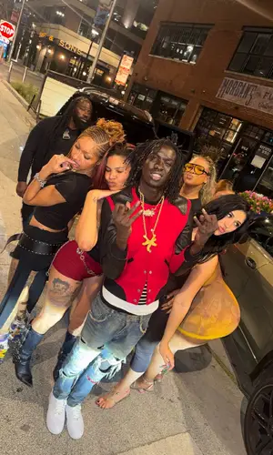 Pz' wearing Nike sneakers