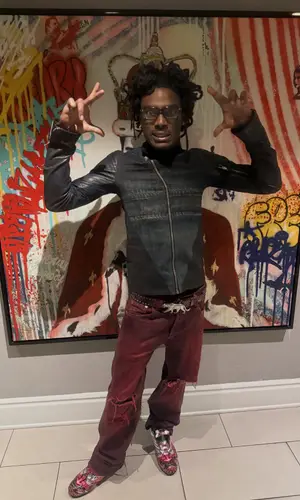 Teezus wearing Adidas boots