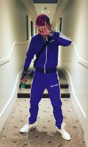Lil Peep wearing Converse sneakers