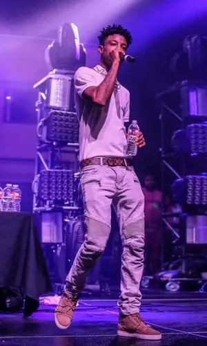 21 Savage wearing Louis Vuitton belt