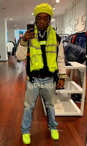 Lil Uzi Vert wearing Louis Vuitton scarf
