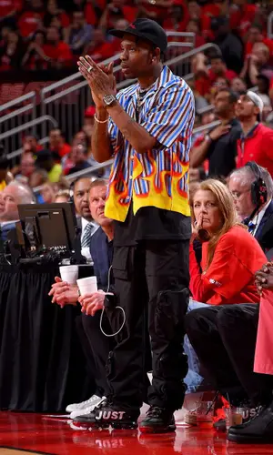 Travis Scott wearing Prada shirt