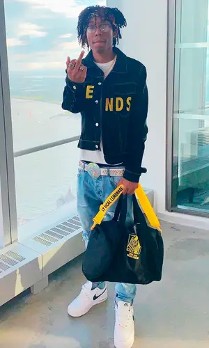 Lil Tecca wearing Lyrical Lemonade bag