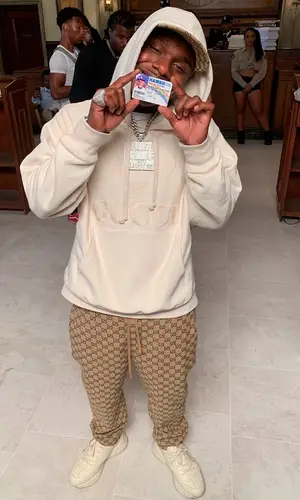 DaBaby wearing Gucci trousers