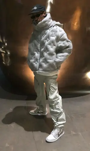 Travis Scott wearing Space Village cap