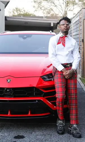 21 Savage wearing Gucci shirt