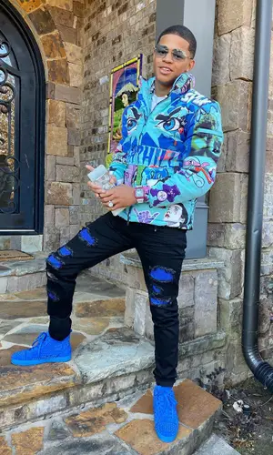 YK Osiris wearing Sugarhill jacket