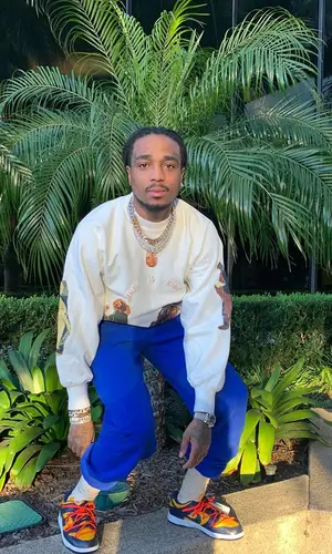 Quavo wearing Kanye West Merch sock