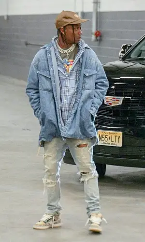 Travis Scott wearing Maison Margiela shirt