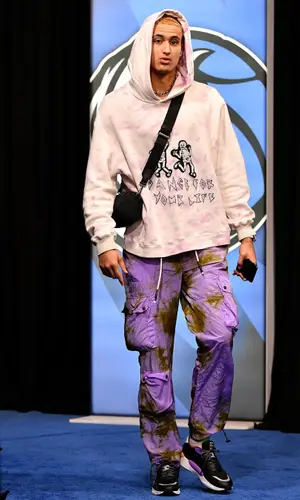 Kyle Kuzma wearing Dior bag