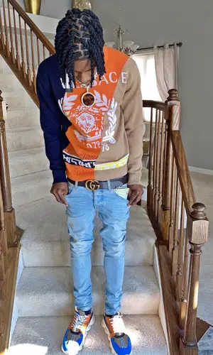 Polo G wearing Versace sweater