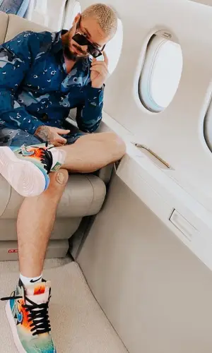 J Balvin wearing Louis Vuitton shirt