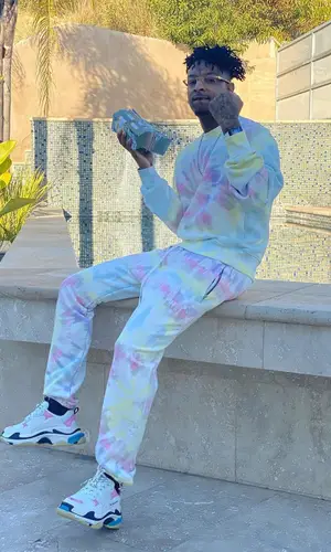 21 Savage wearing Amiri sweatshirt