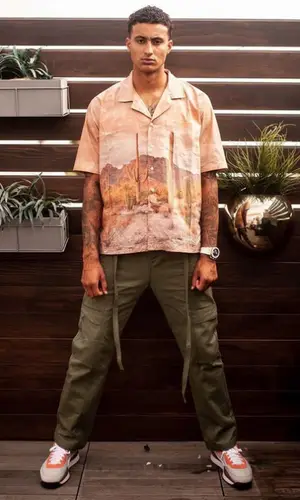 Kyle Kuzma wearing Rhude shirt
