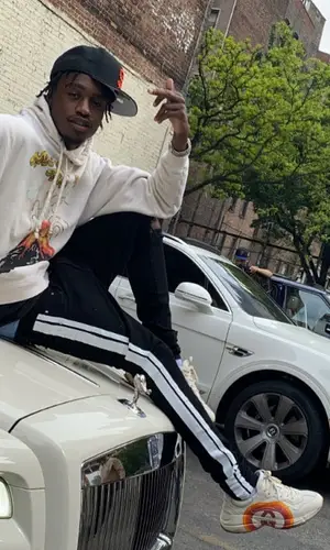 Lil Tjay wearing Gucci sweatshirt