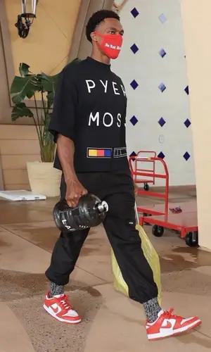 Rajon Rondo wearing Pyer Moss t-shirt