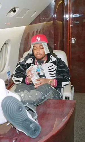 Takeoff wearing Nike sneakers