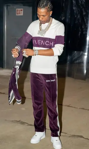 Lil Baby wearing Palm Angels trousers