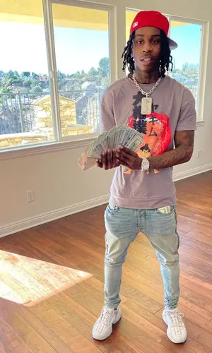 Polo G wearing New Era cap