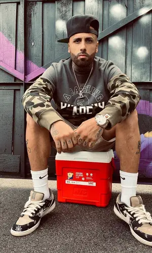 Nicky Jam wearing Bape sweatshirt