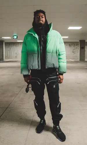 JuJu wearing Adidas sneakers