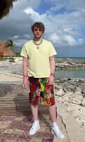 Murda Beatz wearing Gucci shorts