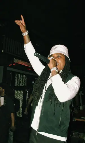 Jacquees wearing Prada top