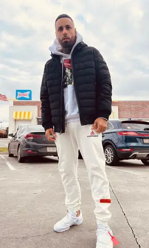 Nicky Jam wearing DKNY jacket