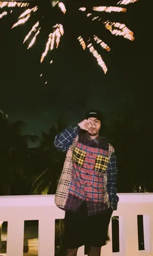 Rauw Alejandro wearing Nike sock
