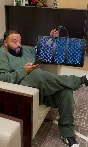 DJ Khaled wearing Louis Vuitton bag