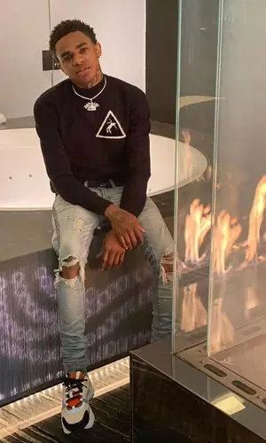 Almighty Jay wearing Louis Vuitton belt