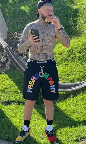 Farruko’s Outfit in Jordan Sneakers, Fendi Cap & Supreme Underwear (2021)