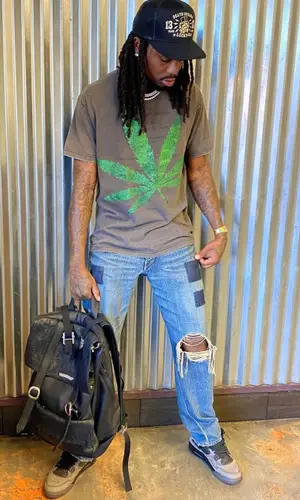 Quavo wearing Lucky 13 cap