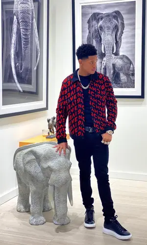 YK Osiris wearing Givenchy jacket